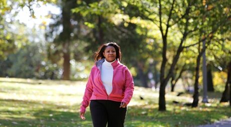 Woman walking through the park