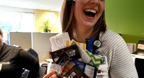 Woman laughing holding supplies