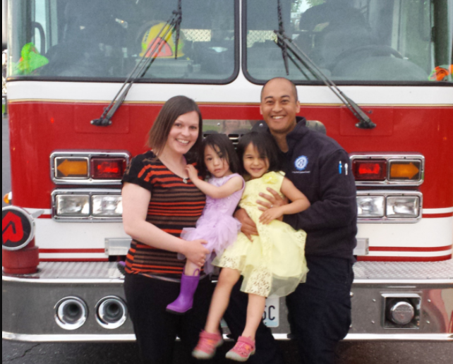 Family in front of a fire truck