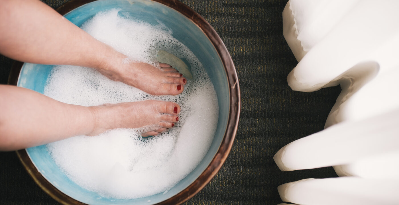 Feet soaking in a tub