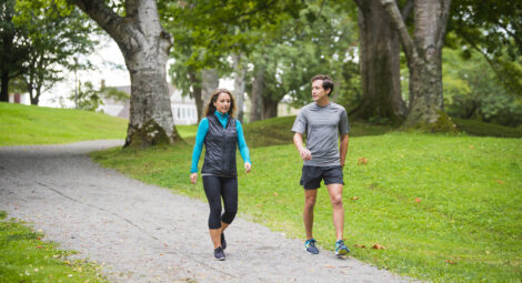 Man and woman walking a path