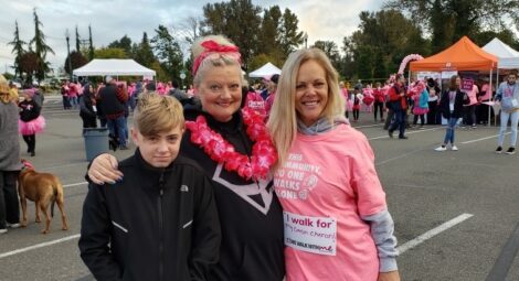 Two women and a child participating in a walking event