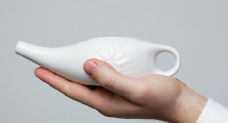 Hand holding saline rinse