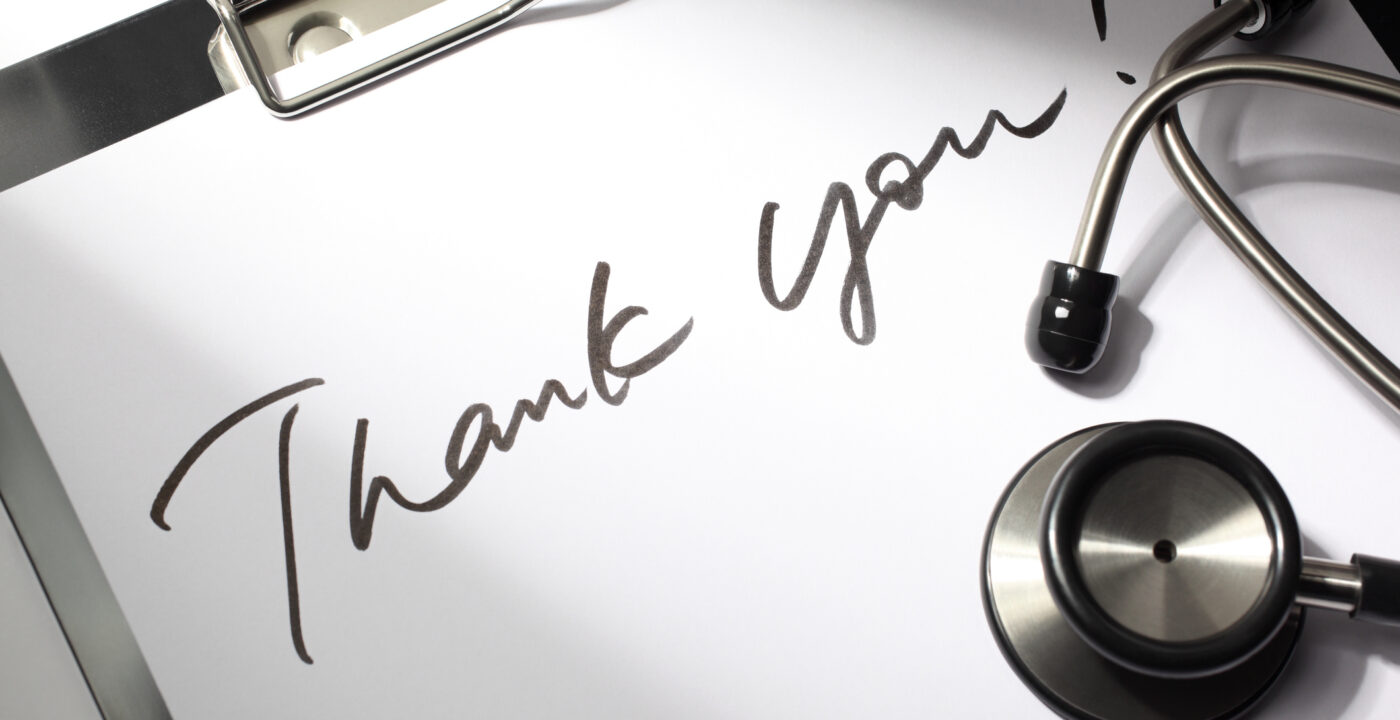Note on clipboard saying thank you