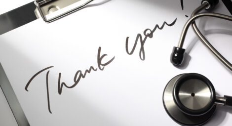 Note on clipboard saying thank you