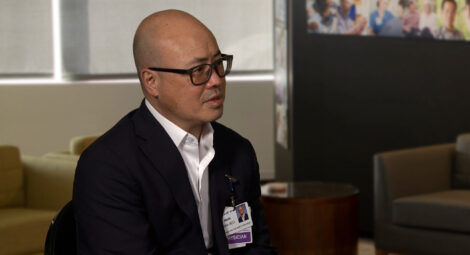 Dr. Mike Myint speaking to a camera