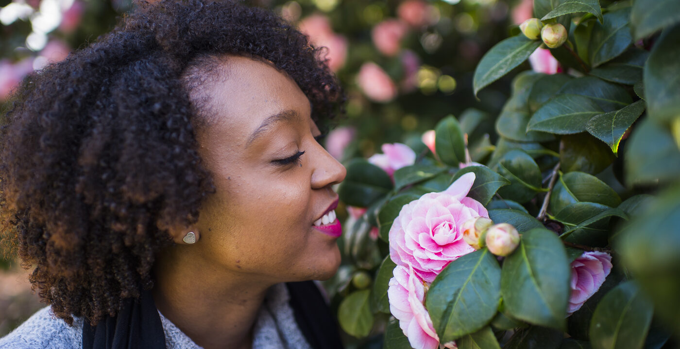 Woman smelling roses