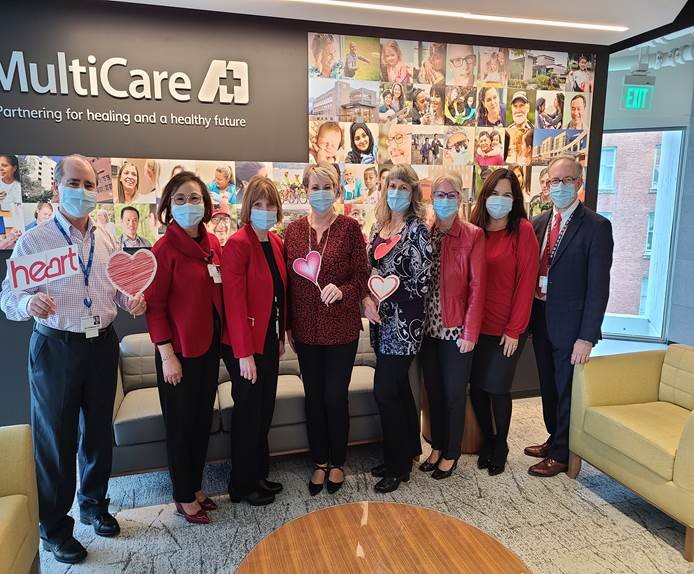 A group of leadership standing together wearing masks.