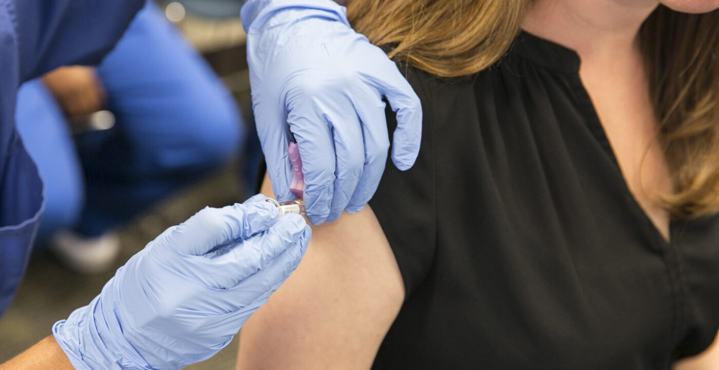 Woman getting a flu shot.