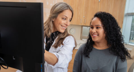 Health care worker and patient looking at a computer screen