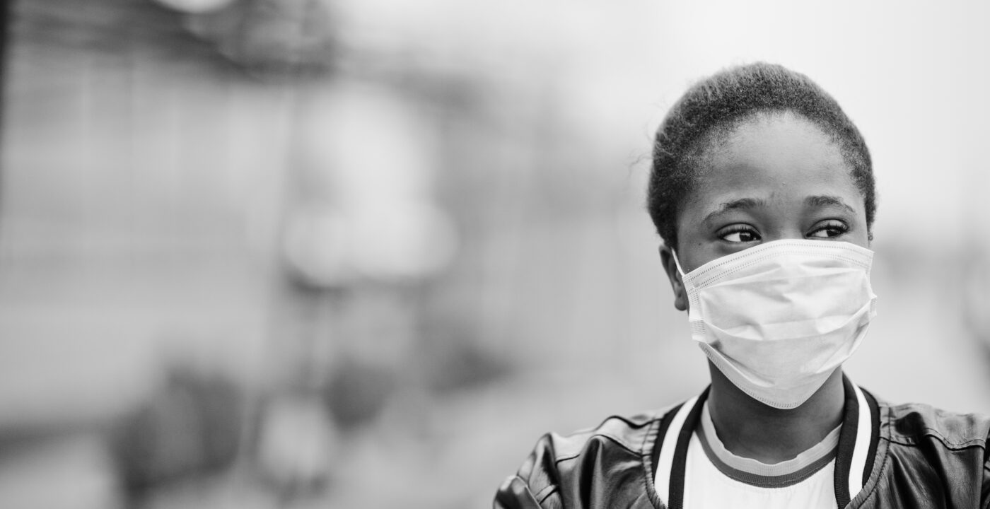 Black woman wearing a mask