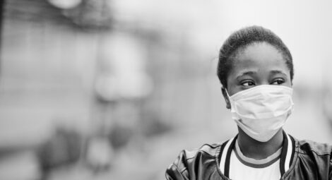 Black woman wearing a mask