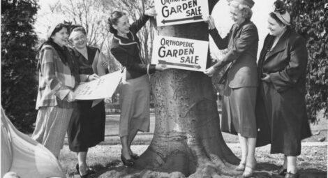 Old photo of women hosting a garden show