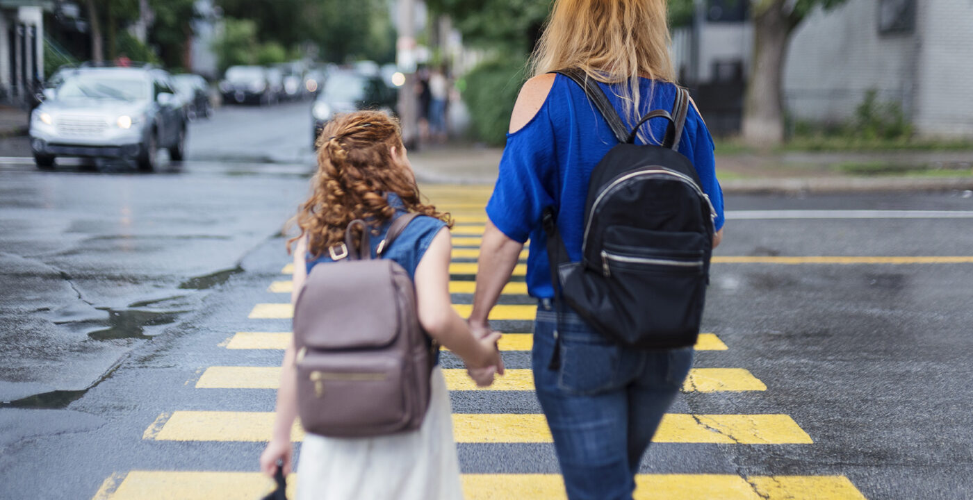 Child and mother walking to school