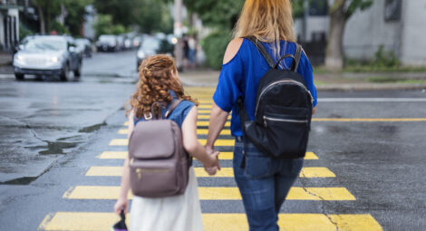Child and mother walking to school