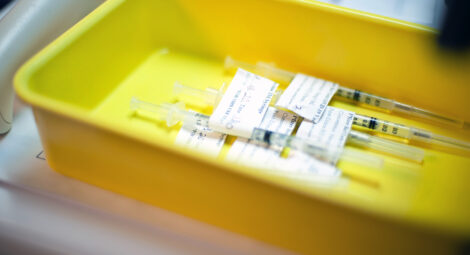 Vaccine shots laying in a tray