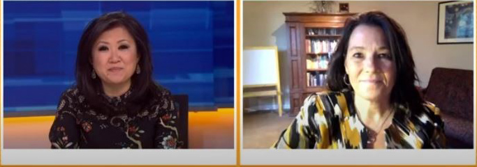 News reporter talking to a woman