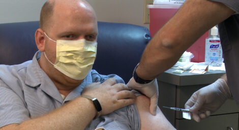 Man receiving COVID-19 vaccine