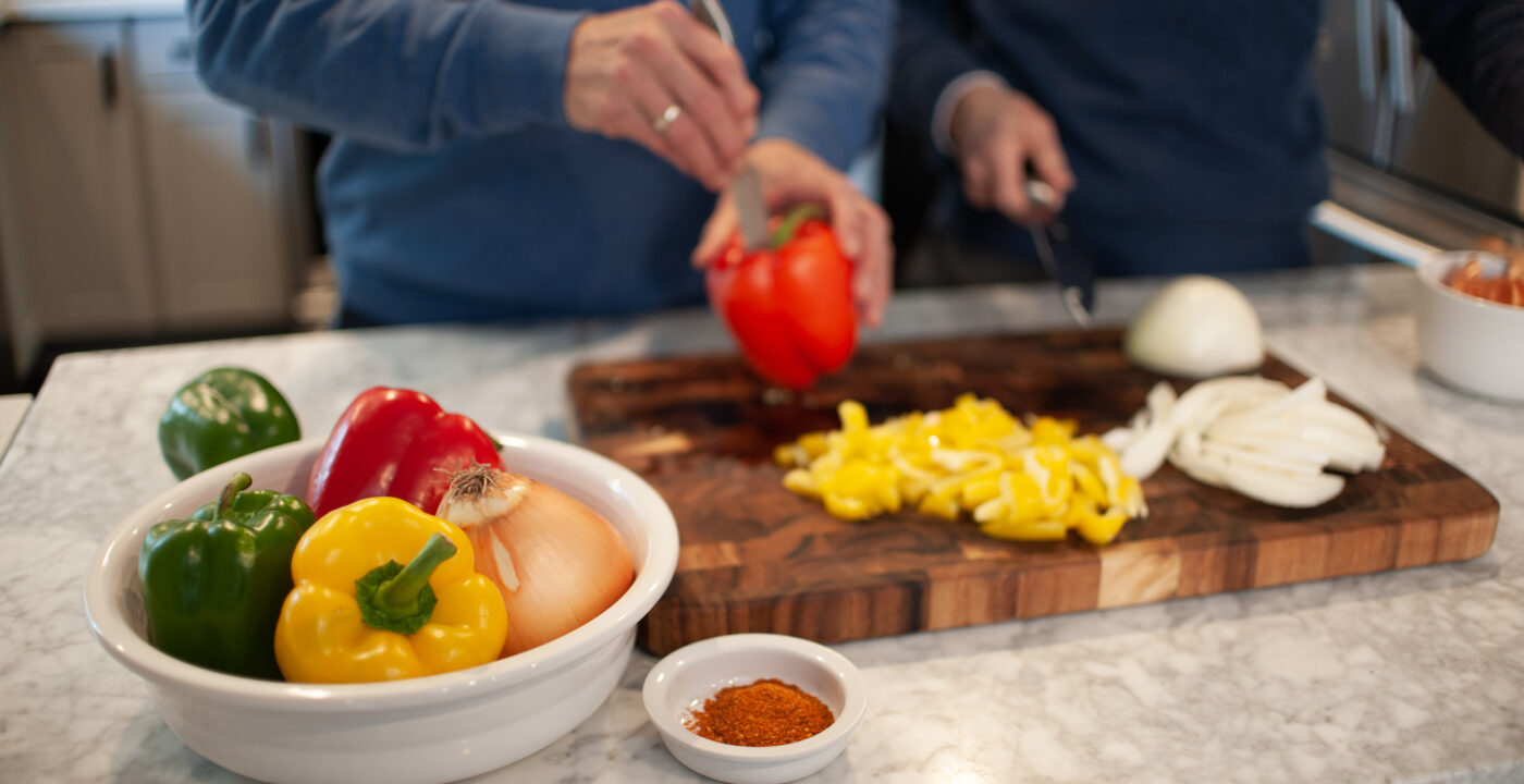 Two men preparing a healthy snack