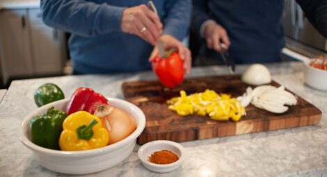 Two men preparing a healthy snack