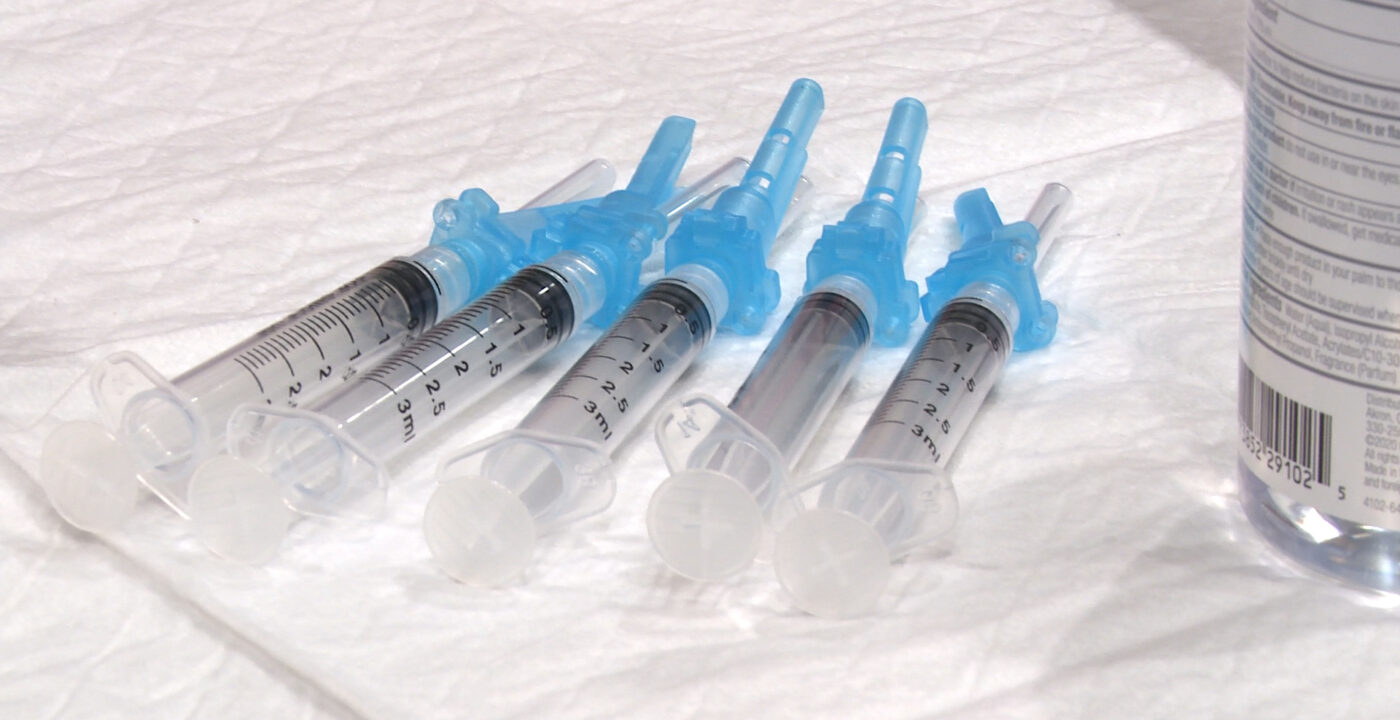 Five COVID vaccines in a line