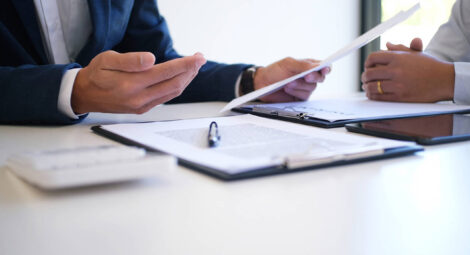 Stock image of man explaining documents