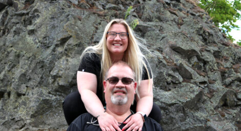 Father and daughter smiling at the camera