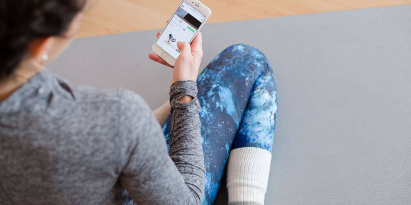 Person following exercises on phone