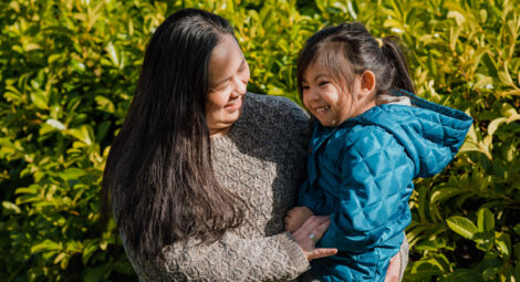 Mother holding daughter