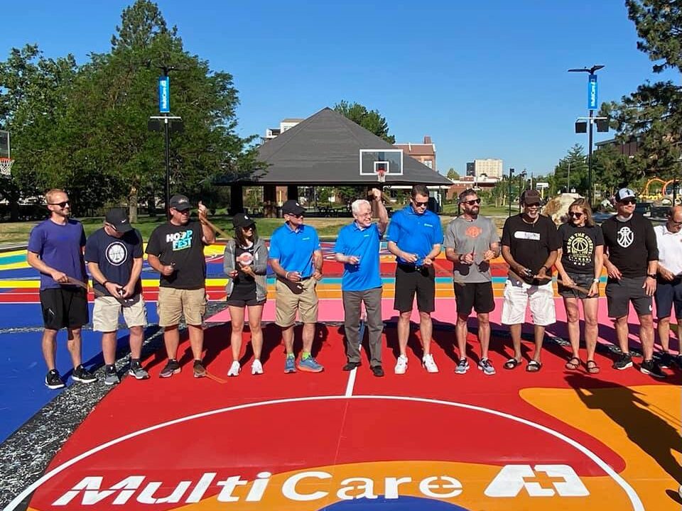 MultiCare staff gathered on a basketball court