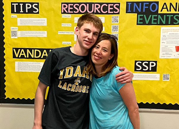 Young man and his mom hugging