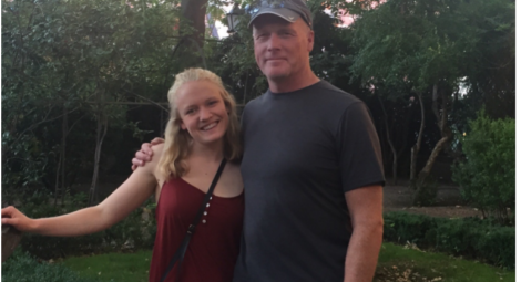 Father and daughter smiling