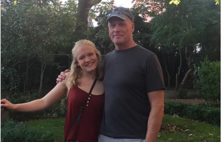 Father and daughter smiling