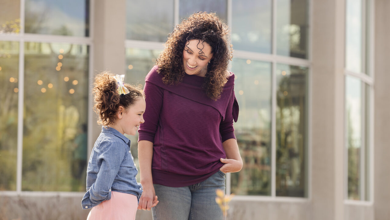 Mom and daughter smiling