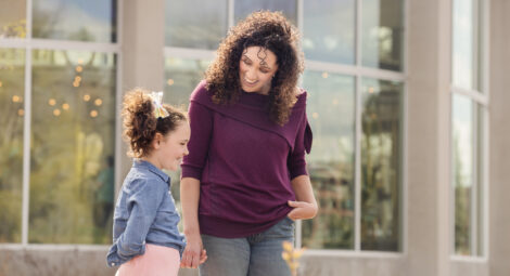 Mom and daughter smiling