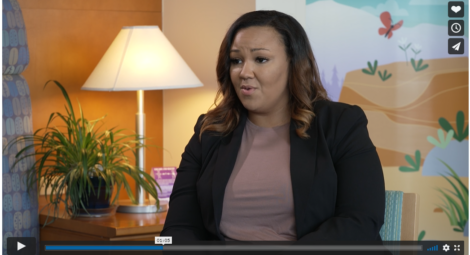 Screenshot of a woman speaking on video