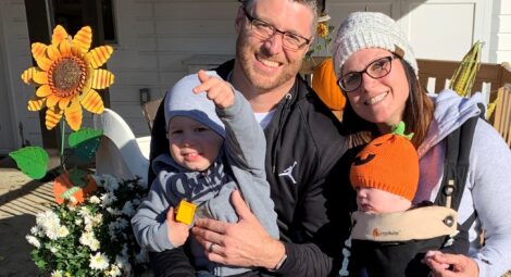 Family in a pumpkin patch posing