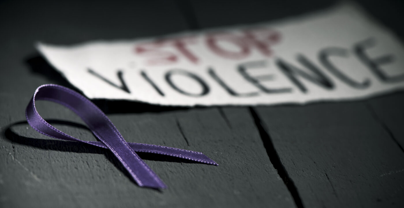 Stop violence sign with ribbon