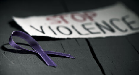 Stop violence sign with ribbon