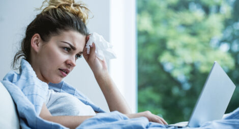 Woman sick on the couch