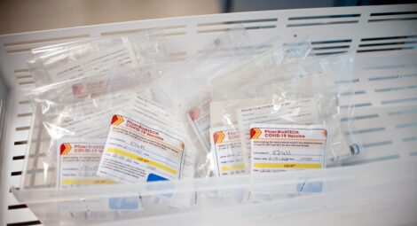 Bin full of COVID-19 booster shots