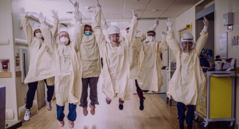 Health care workers jumping for joy