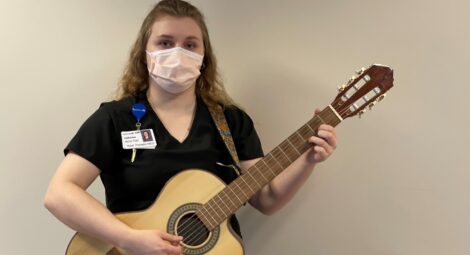 Nurse playing guitar