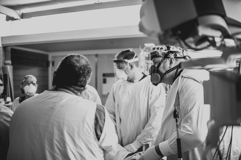 Black and white photo of people in operating room