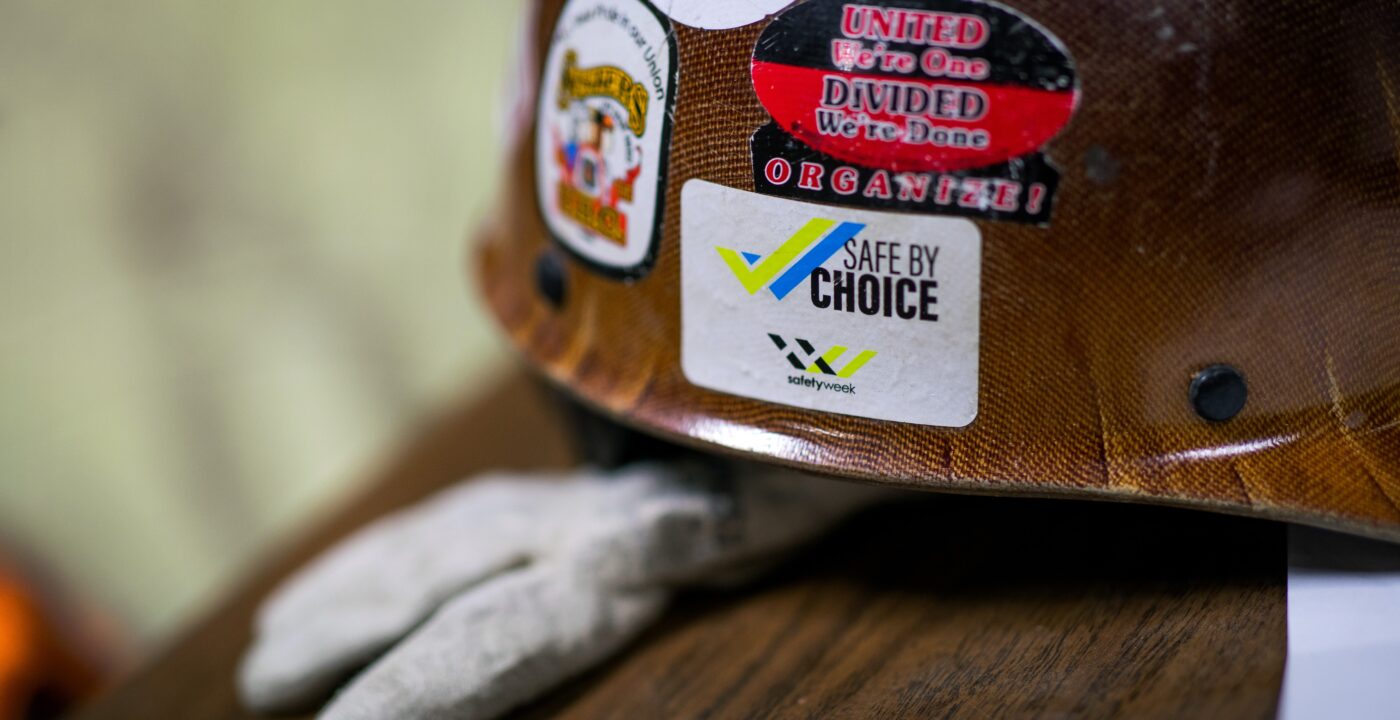 Hard hat with safety stickers on it