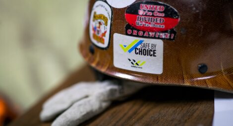 Hard hat with safety stickers on it