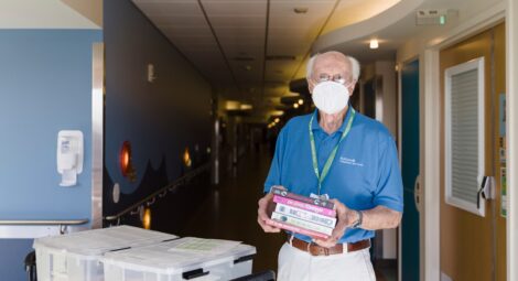 Masked man volunteering