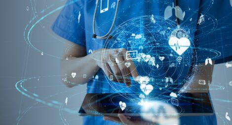 Woman health care professional surrounded by technology