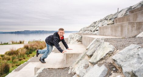 Young boy climbing rocks