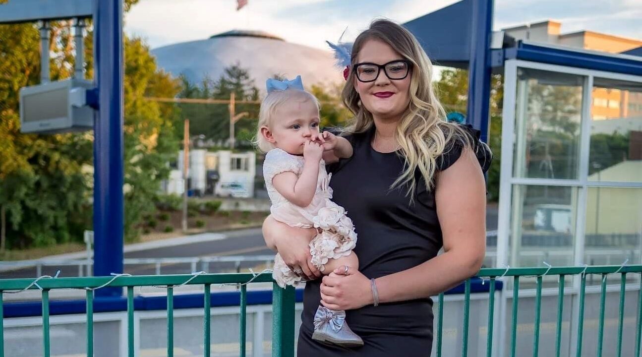 Mom and daughter smiling